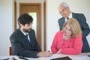 Medicare agent explaining T65 and AEP lead strategies to agency owner, representing the comparison of T65 leads AEP leads