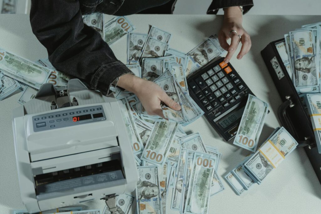 Calculator showing cost analysis for Medicare leads with money stacks and a Medicare card, symbolizing ROI maximization