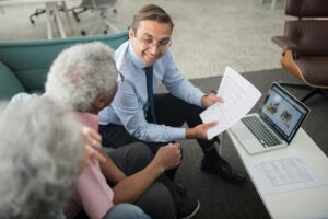 Insurance agent assisting a senior client, with a digital map showing local search results for Medicare agents, symbolizing local SEO for Medicare leads.