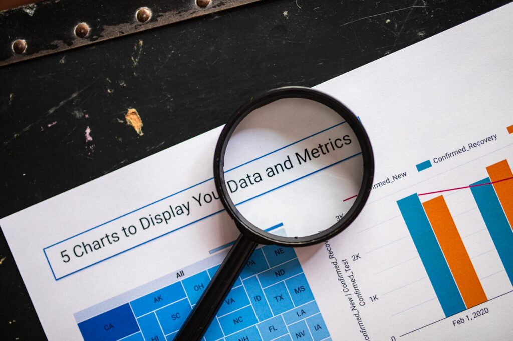 Magnifying glass examining documents related to Medicare lead providers review, symbolizing due diligence and scam prevention